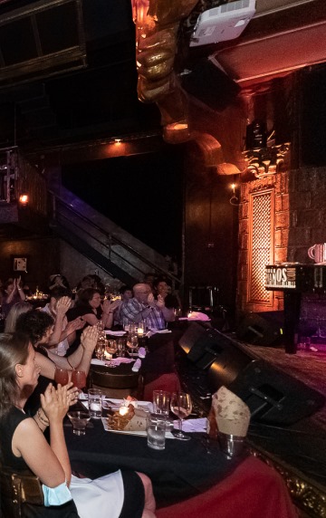 Audience applauds at the beginning of a dueling pianos show on Saturday night in New York!